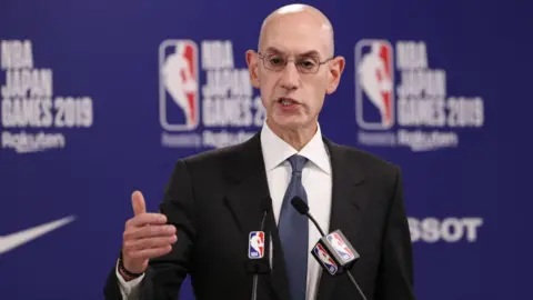 Getty Images Adam Silver speaking at a press conference in Japan on 8 October