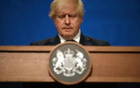 Getty Images Britain's Prime Minister Boris Johnson gives an update on relaxing restrictions imposed on the country during the coronavirus covid-19 pandemic at a virtual press conference inside the Downing Street Briefing Room in central London on July 12, 2021