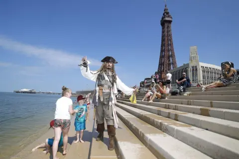 Martin Rickett/PA Wire Captain Jack impersonator in Blackpool