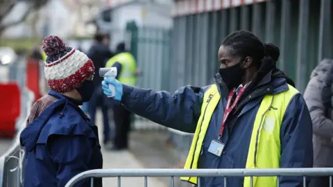 Reuters Rugby Union spectator gets temperature checked at Twickenham, London in December 2020