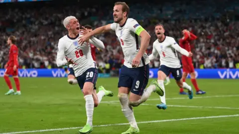 Reuters Harry Kane with Phil Foden