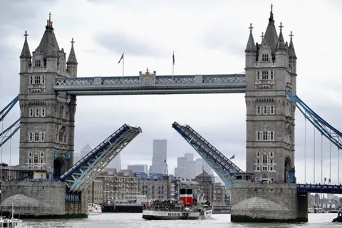 PA Media Tower Bridge opens to allow The Waverley to pass