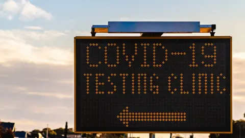 Getty Images Covid-19 testing clinic sign with arrow