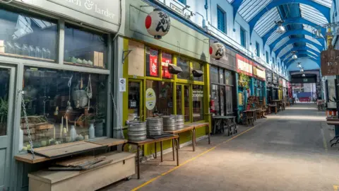 Getty Images Cafes and shops closed in Brixton market