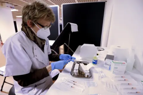 EPA A nurse prepares a dose of the Pfizer-BioNTech COVID-19 vaccine in Cannes, France, 09 January 2021.
