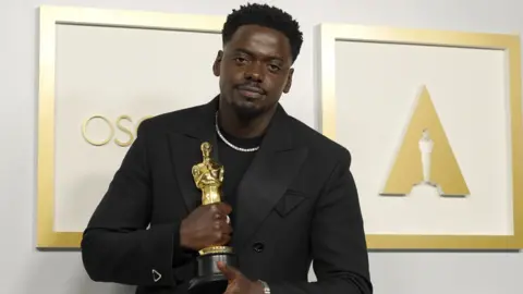 EPA Daniel Kaluuya with his Oscar in 2021