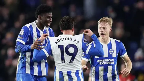 Charalampos Kostoulas celebrates after earning Brighton a point against Bournemouth