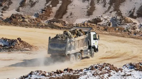 Earth and minerals are loaded onto a truck at an open-pit mine in Donetsk region in February.