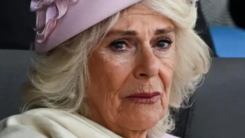 Getty Images Queen Camilla grows tearful during event