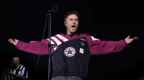 PA Media Sam Fender performs on stage at St James' Park in Newcastle Upon Tyne. June 9, 2023. 