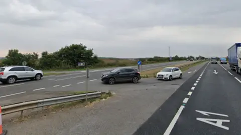 Cars waiting to drive through the gaps on the A1 with traffic travelling in both directions