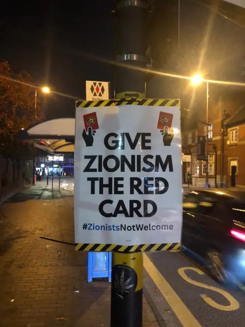 Elliot Ludvig A poster reading "Give Zionism The Red Card"