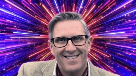 Close-up portrait of a person wearing dark-framed glasses and a light-colored jacket, centered against a vivid digital background of radiant purple, pink, and blue light streaks bursting outward from behind the head. The image has a stylised, energetic appearance with bright neon colors and a futuristic effect.