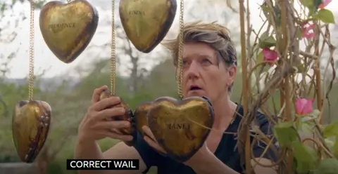 Clare Balding opening a locket, with the subtitle "correct wail"