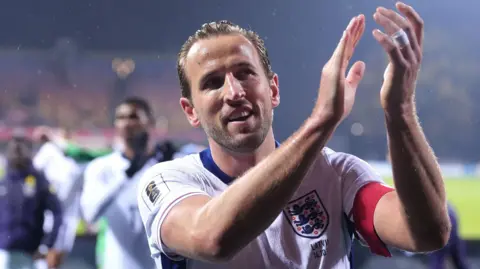 Harry Kane applauding England fans