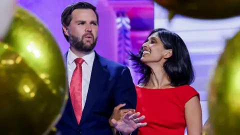 Republican vice presidential nominee Senator JD Vance and his wife Usha react on stage at the conclusion of the Republican National Convention at Fiserv Forum in Milwaukee, Wisconsin, USA, on 18 July 2024