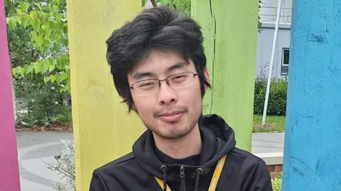 Student Jiangwei Liao smiling 