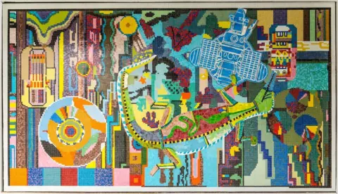 Arts in Redditch A brightly-coloured mural with many different shapes. 