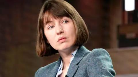 Getty Images Sally Rooney has a bob style haircut and is wearing a blue blazer