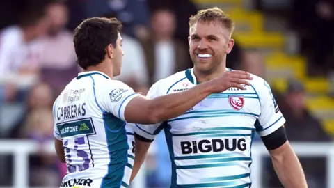 Chris Harris (right) celebrates a try with team-mate Santiago Carreras 