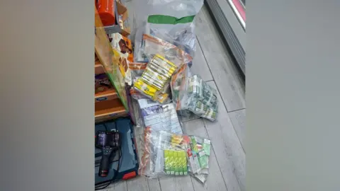 Sudbury and Haverhill Police Tobacco products in clear plastic bags and on a shop floor