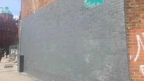 Jacob Evans/BBC The painted over wall