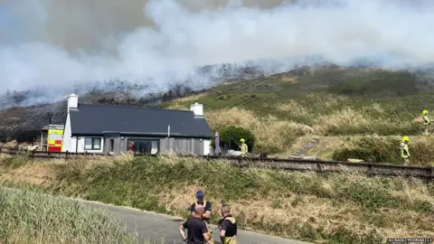 @craig_thomas111 Pembrokeshire fire fighters were dealing with a grass fire above Newgale, in very hot conditions