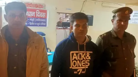 Ghaziabad police/Twitter The suspect, named by police as Shringi Nandan Yadav (centre)