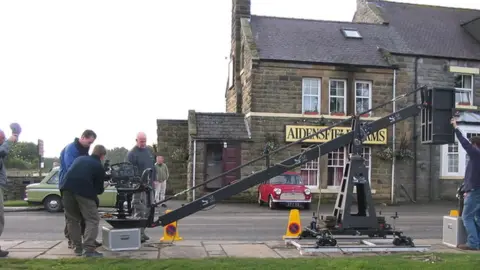 David Seale/Geograph Goathland Hotel with filming crew outside