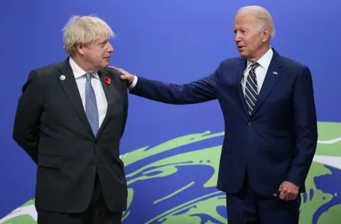 EPA British Prime Minister Boris Johnson greets US President Joe Biden at the COP26 UN Climate Change Conference in Glasgow on 1 November 2021