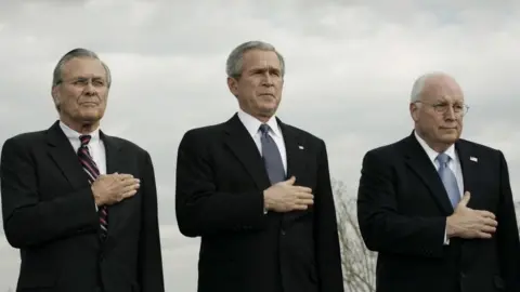 Getty Images US Secretary of Defense Donald Rumsfeld, US President George W. Bush, Vice President Richard Cheney at the Armed Forces Full Honor Review in Honor of the Secretary of Defense at the Pentagon December 15, 2006 in Arlington, Virginia