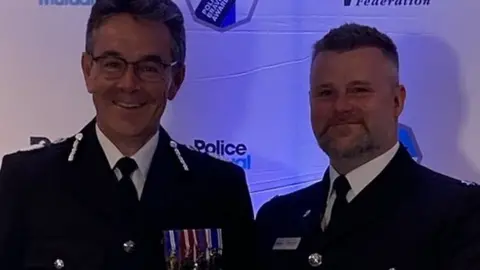 Lincolnshire Police Image of two police officers at awards ceremony
