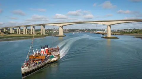 Jeff Welch Paddle Steamer Waverley on the River Orwell in Suffolk, with the Orwell Bridge and Ipswich in the background