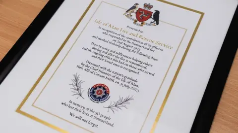 Isle of Man Government/Matt Mosur Scroll of recognition to fire service