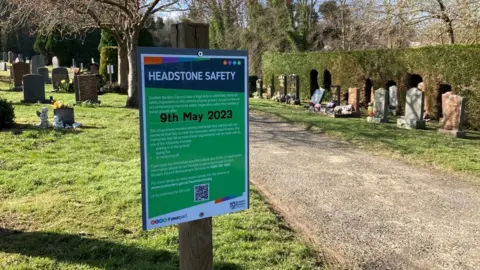 More prominent signs are now being posted in cemeteries which are about to be tested.