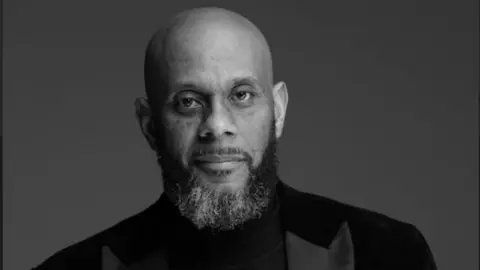 Northants Sings Out Gareth Fuller with dark beard in black and white photo