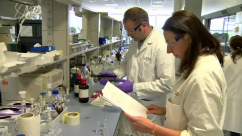 Almac staff at work in a laboratory