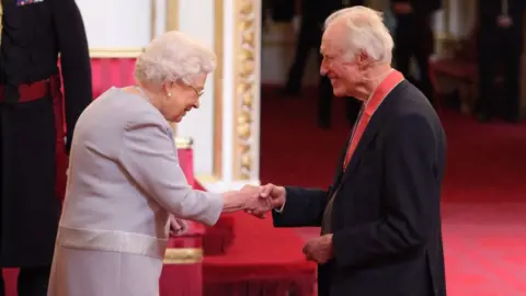 PA Media Bamber Gascoigne being made a CBE by the Queen in 2018