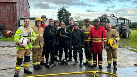 NIFRS Commander John Holmes and colleagues