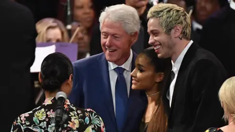 Getty Images Bill Clinton, Ariana Grande, Pete Davidson