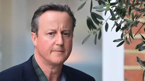 Former Prime Minister David Cameron leaves his home to give evidence to a select committee on Greensill, on May 13, 2021 in London, England.