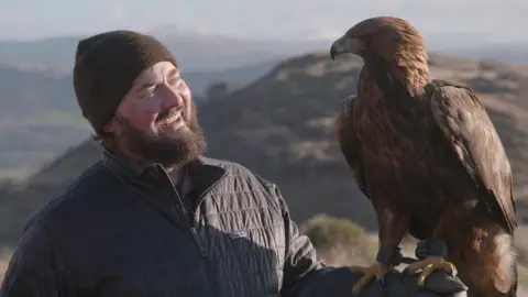 Wilder Britain Paul O'Donoghue holding a golden eagle
