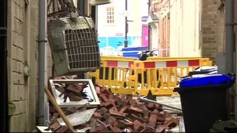 BBC Large amounts of debris can be seen where the explosion took place