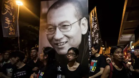 Getty Images People attend a candlelight march for the late Chinese Nobel laureate Liu Xiaobo in Hong Kong on July 15, 2017.