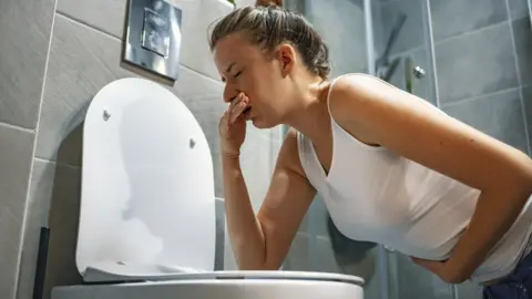 Getty Images woman feeling sick