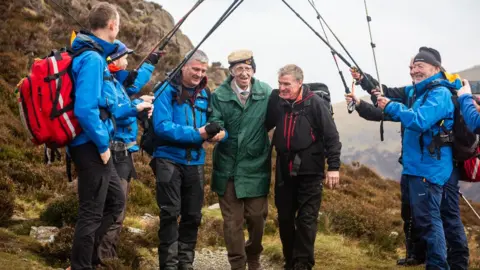 Cockermouth Mountain Rescue Team A team of 17 volunteers helped Mr Nichol climb up to Innominate Tarn