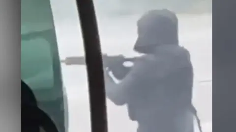 Gunman pointing gun