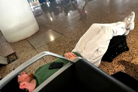 Scott Coyle Scott Coyle sleeping on the airport floor