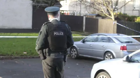 Pacemaker A police man at the scene pictured from behind