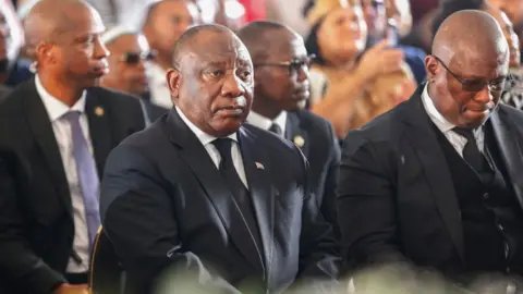AFP South Africa President Cyril Ramaphosa at the funeral in East London, South Africa - 6 July 2022